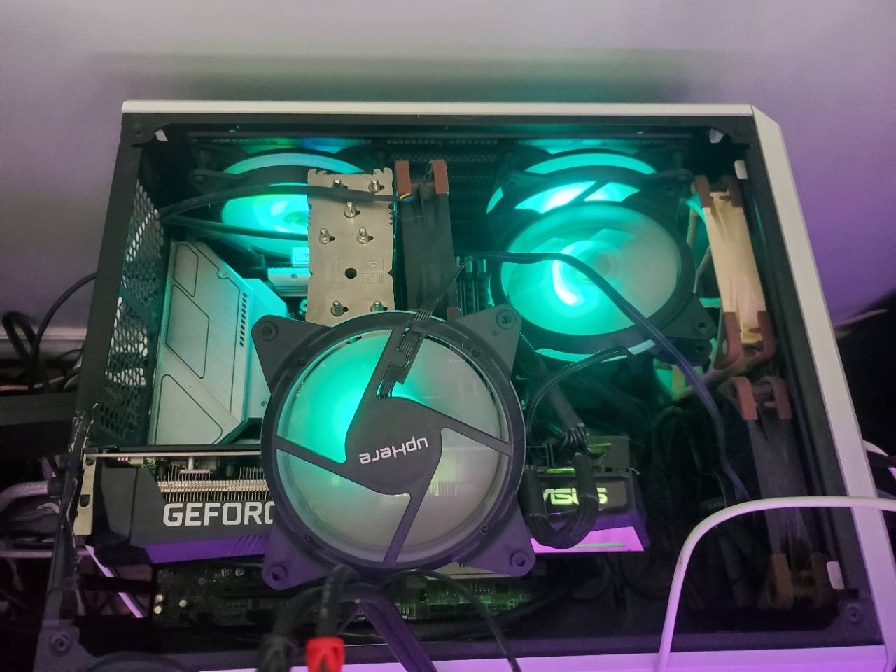 Mustang Sally, the creator’s open-sided PC with teal-lit fans and a GeForce graphics card.